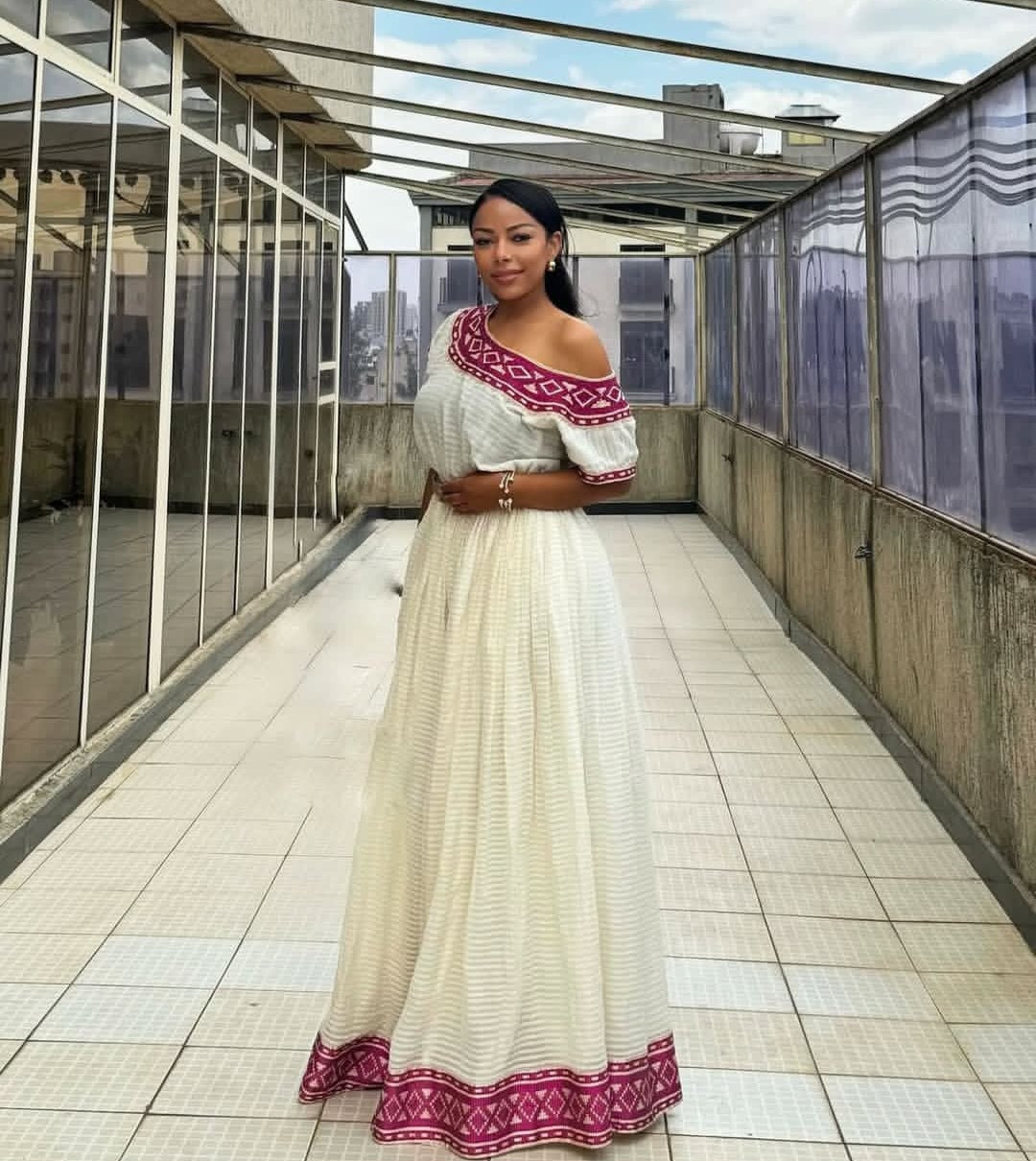 Radiant Habesha Kemis with purple Tibeb – Elegant Ethiopian Dress