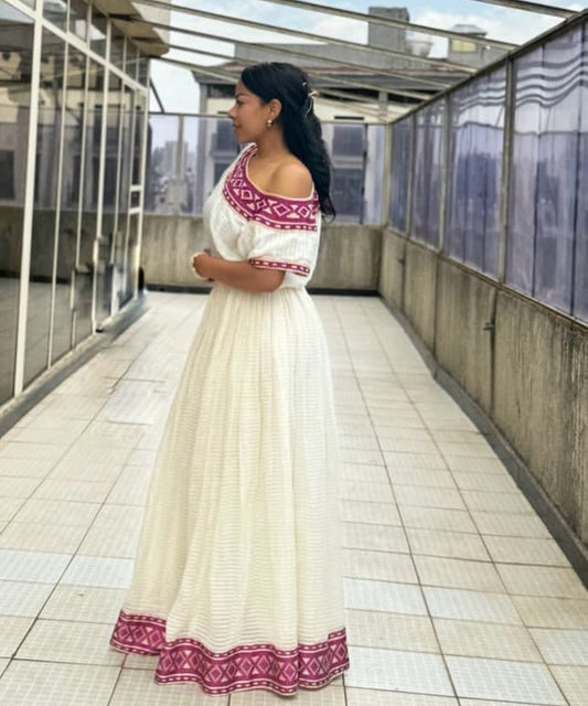 Radiant Habesha Kemis with purple Tibeb – Elegant Ethiopian Dress