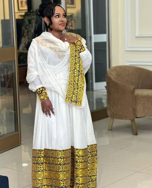 Traditional Habesha Kemis – White Ethiopian Dress with Yellow Tibeb Accents