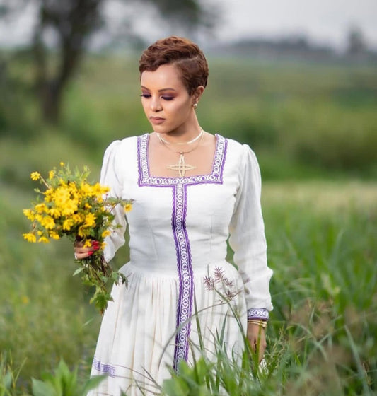 Modern Ethiopian Dress – White Habesha Kemis with Elegant Purple Tibeb Design