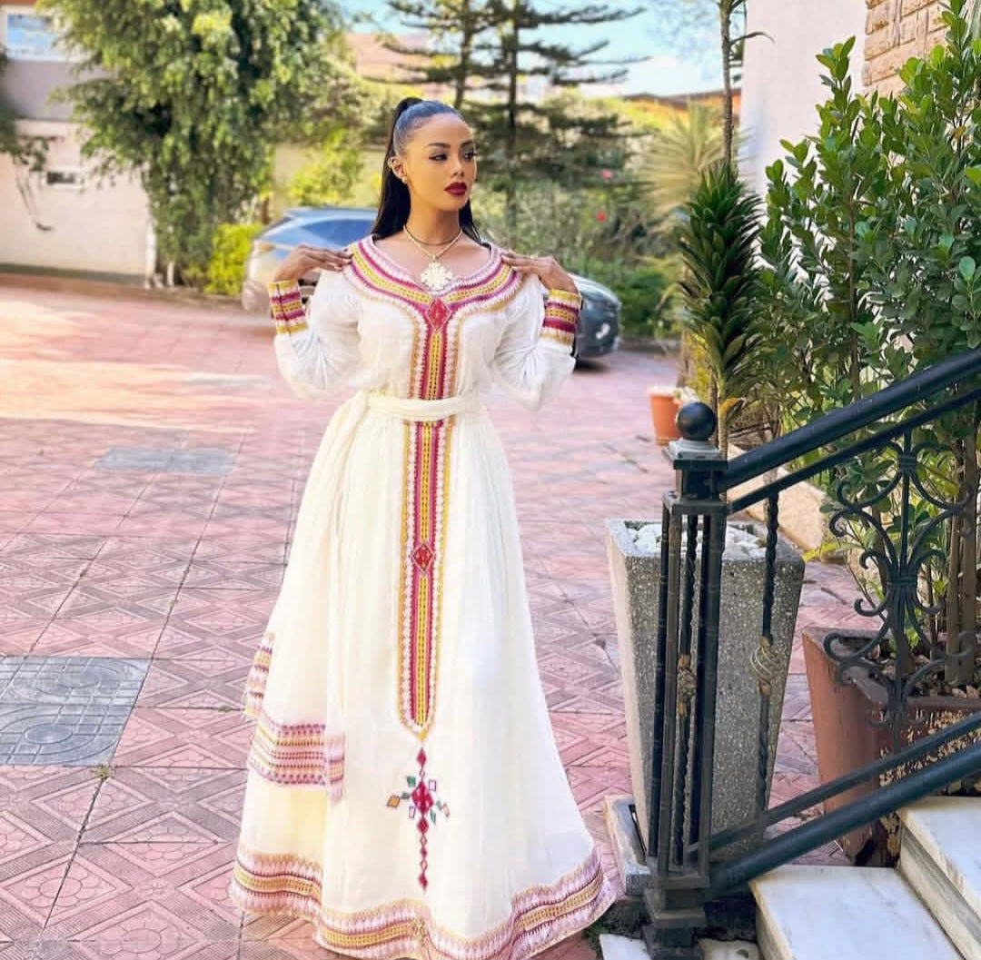 Festive Habesha Kemis – White Ethiopian Dress with Pink Tibeb Design
