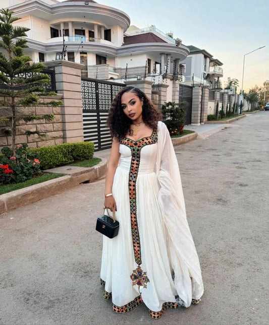 White Habesha Kemis with Vibrant Tibeb β Modern Ethiopian Traditional Dress