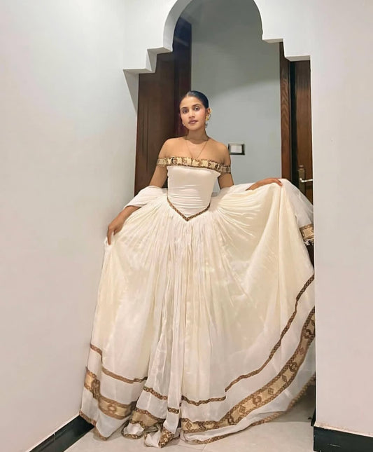 Elegant Habesha Dress with Gold Trim β Off-Shoulder Style