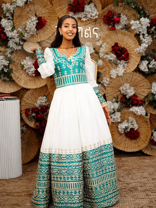 Woman in a Ethiopian cultural wedding dress with a decorative background