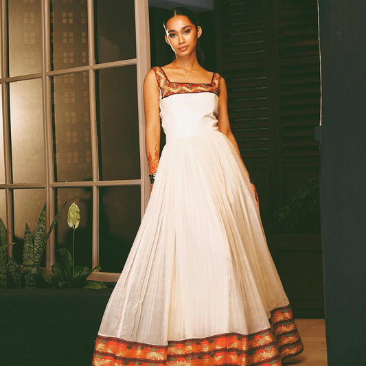 Modern Habesha Kemis β White Handwoven Ethiopian Dress with Vibrant Border