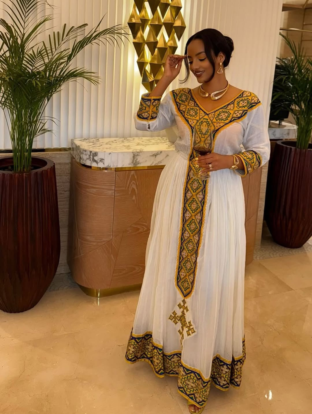White Habesha Kemis with Gold Tibeb Design – Traditional Ethiopian Dress for Women by Tesfaye Mehari