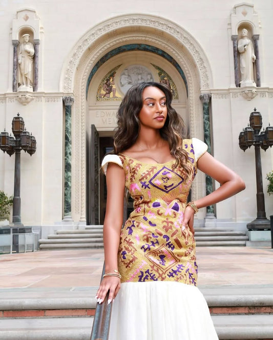 Golden Elegance: Stunning Mermaid Half-Shoulder Habesha Kemis with Exquisite Detailing by Tsehaye Mehari