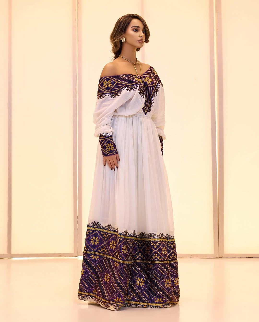 Off-the-Shoulder cultural Habesha Kemis by Tsehaye Mehari | Purple detailed Embroidery