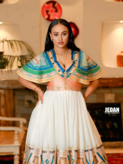 White Ethiopian Kemis – Elegant Traditional Dress with Pleated Skirt and Colorful Hand-Embroidered Patterns