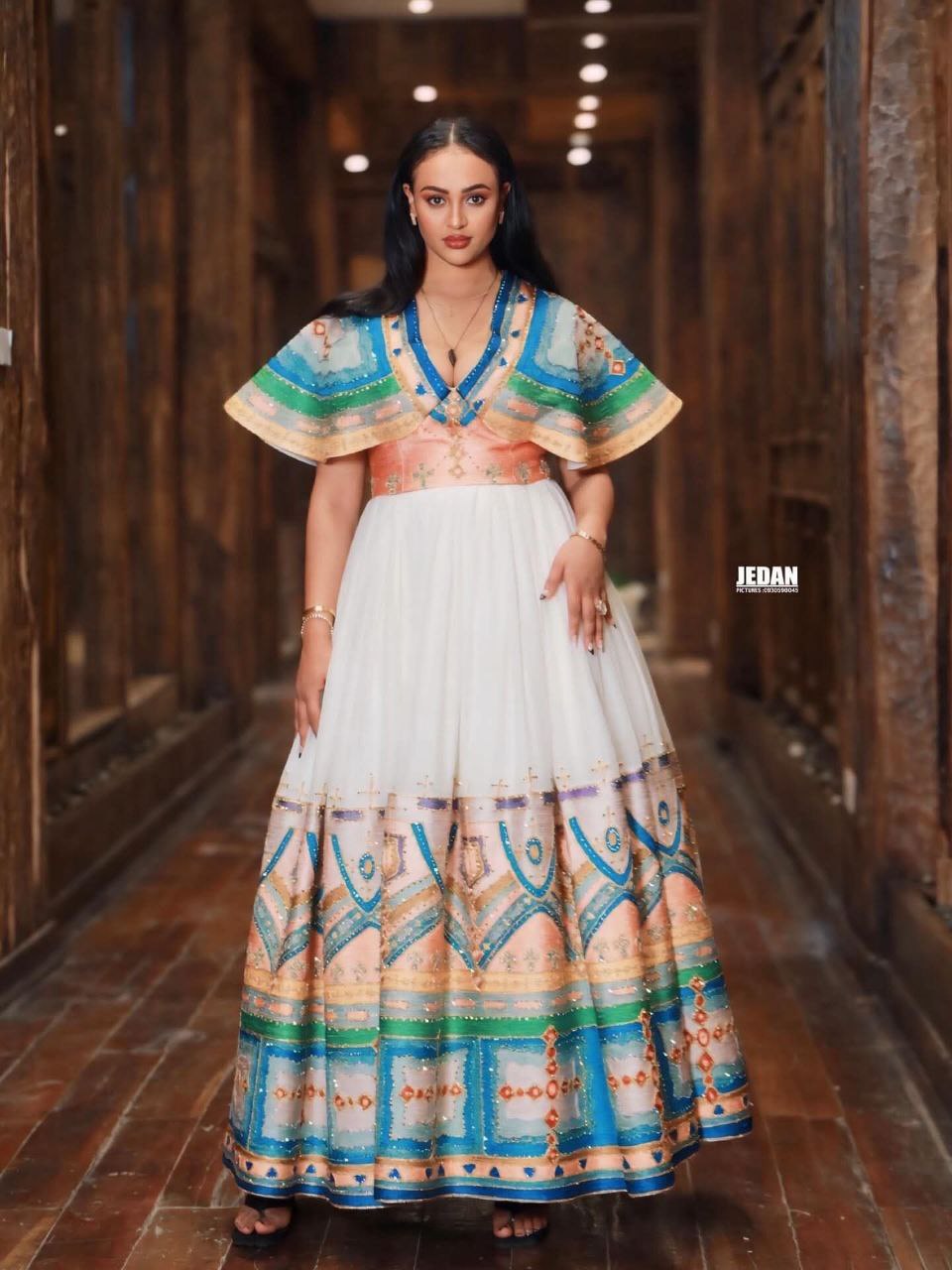 White Ethiopian Kemis – Elegant Traditional Dress with Pleated Skirt and Colorful Hand-Embroidered Patterns