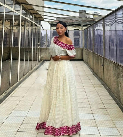 Radiant Habesha Kemis with purple Tibeb – Elegant Ethiopian Dress