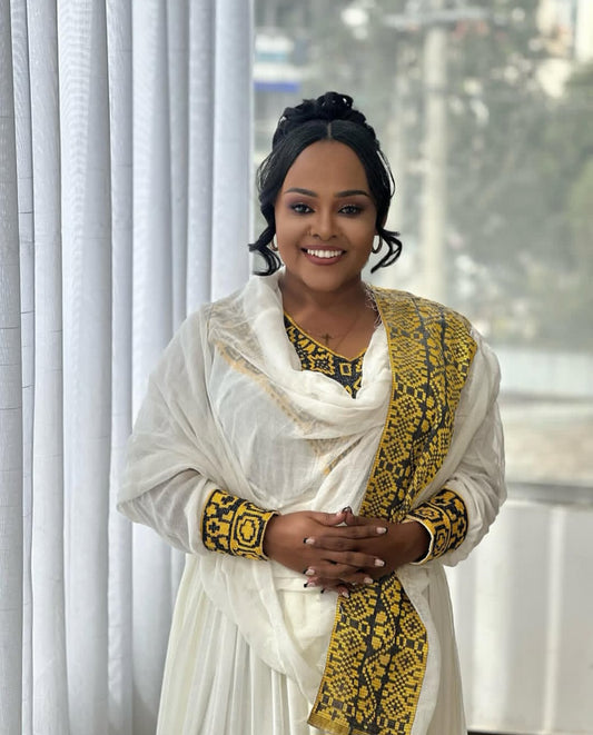 Traditional Habesha Kemis – White Ethiopian Dress with Yellow Tibeb Accents