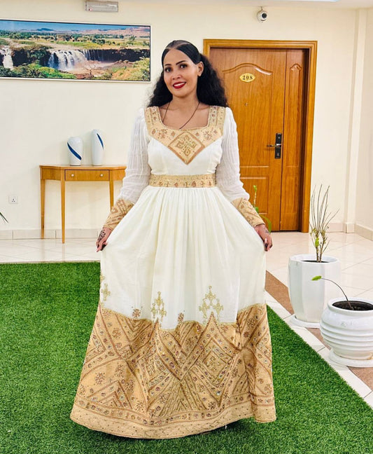 Regal Habesha Kemis – White Ethiopian Dress with Ornate Gold Tibeb Embroidery