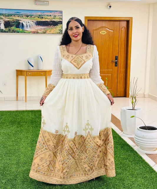 Regal Habesha Kemis – White Ethiopian Dress with Ornate Gold Tibeb Embroidery