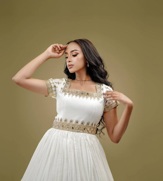 White Habesha Dress with Golden Tibeb – Elegant Ethiopian Traditional Kemis