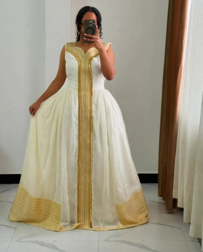Simple Habesha Dress with Gold flowing Tibeb – Classic Ethiopian Traditional Dress