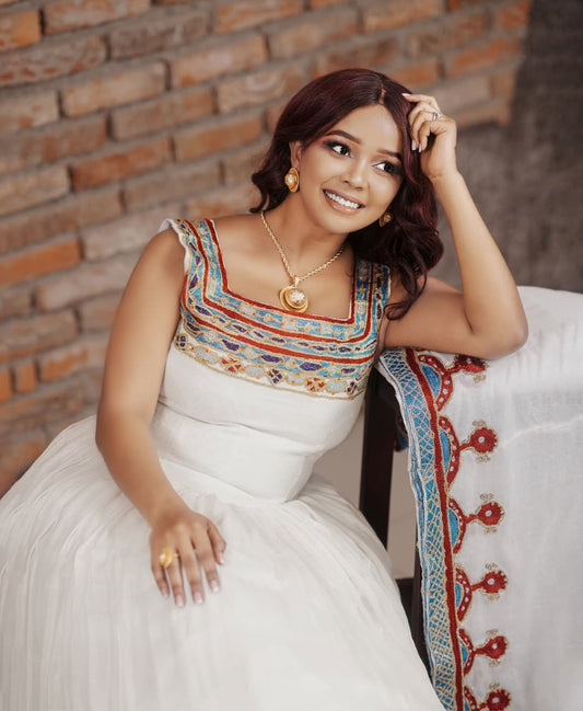 Elegant Ethiopian White Dress with Colorful Embroidery - stunning habesha kemis