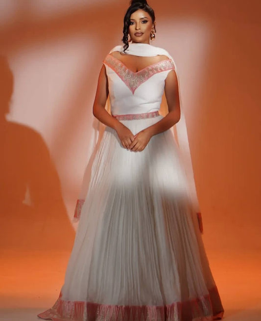 Stylish Two-Piece Habesha Dress with pink Tibeb – Modern Ethiopian Traditional Dress