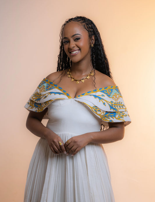 Green Classic Habesha zuria finished with Gold tilf embroidery for engagement ceremonies