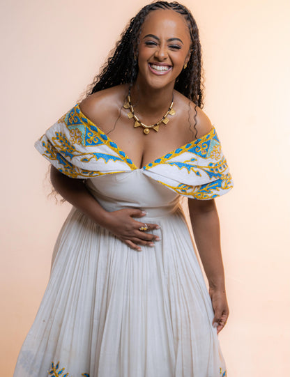 Green Classic Habesha zuria finished with Gold tilf embroidery for engagement ceremonies