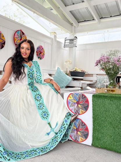 Green Flowing Habesha Dress with Cross Tibeb – Unique Ethiopian Outfit for Cultural Celebrations and Special Events