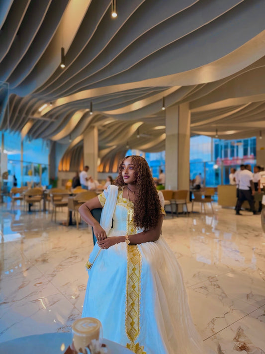 Gold Embroidered Habesha Dress from the Ethiopia Store Online – Flowing Traditional Style for New Year's Eve Parties