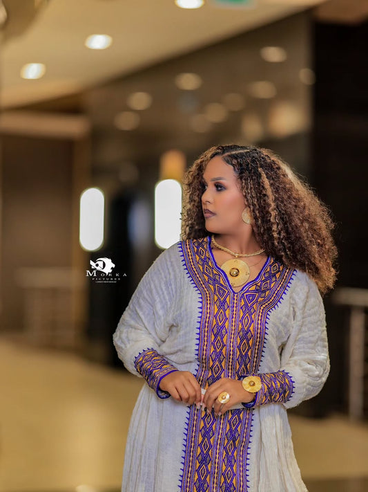 Elegant White Ethiopian Traditional Dress with Purple & Lavender Tilf Embroidery