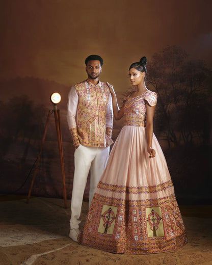 Man and woman in traditional embroidered Habesha Outfit couple Set  standing against a dark background