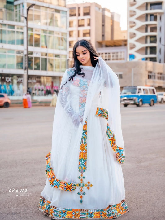Woman wearing a Ethiopian Traditional Dresswith colorful embroidery in an urban setting