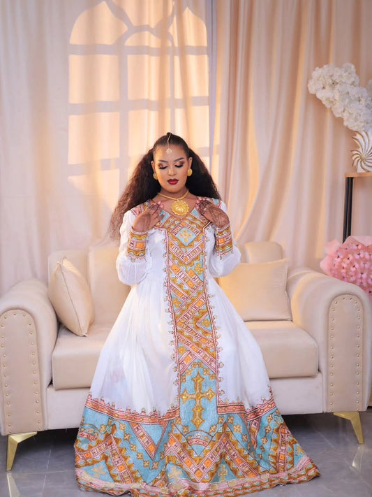 ነጭ የሐበሻ ልብስ በወርቃማ ጥልፍ – የሚያምር በእጅ የተሰራ ቀሚስ