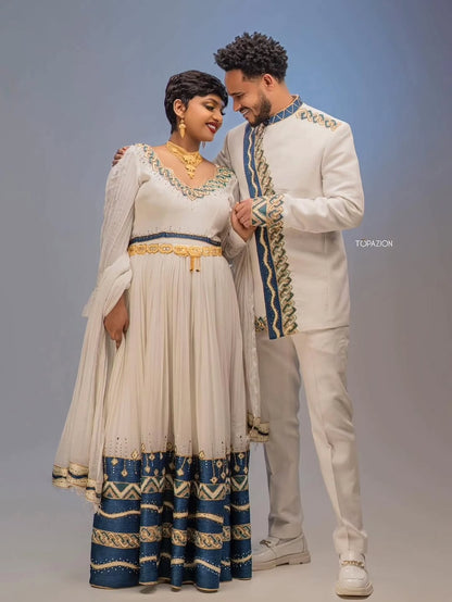 Man and woman in Habesha Couple Matching Set attire standing close together against a plain background