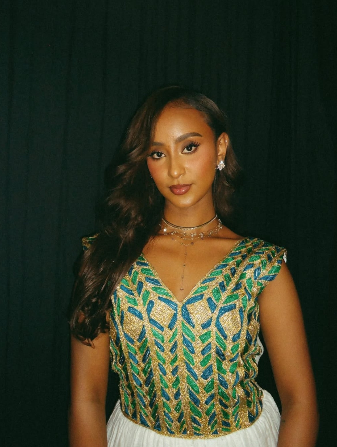 Green Habesha kemis with gold embroidery for diaspora weddings and Timkat celebrations