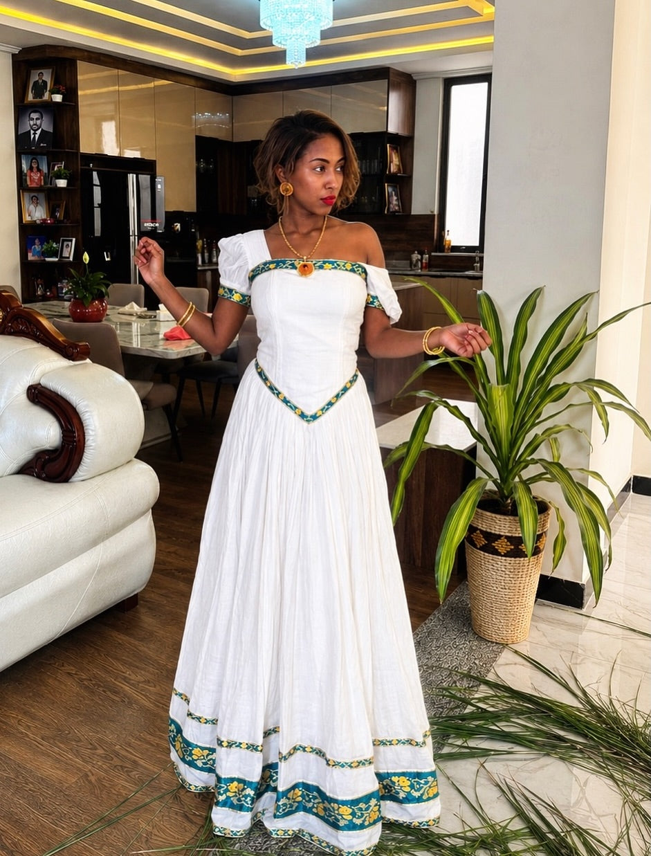 Green Habesha dress with gold embroidery for diaspora weddings and bridal parties