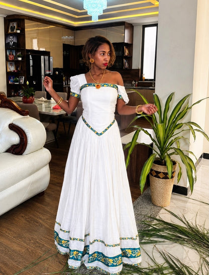 Green Habesha dress with gold embroidery for diaspora weddings and bridal parties