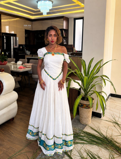 Green Habesha dress with gold embroidery for diaspora weddings and bridal parties