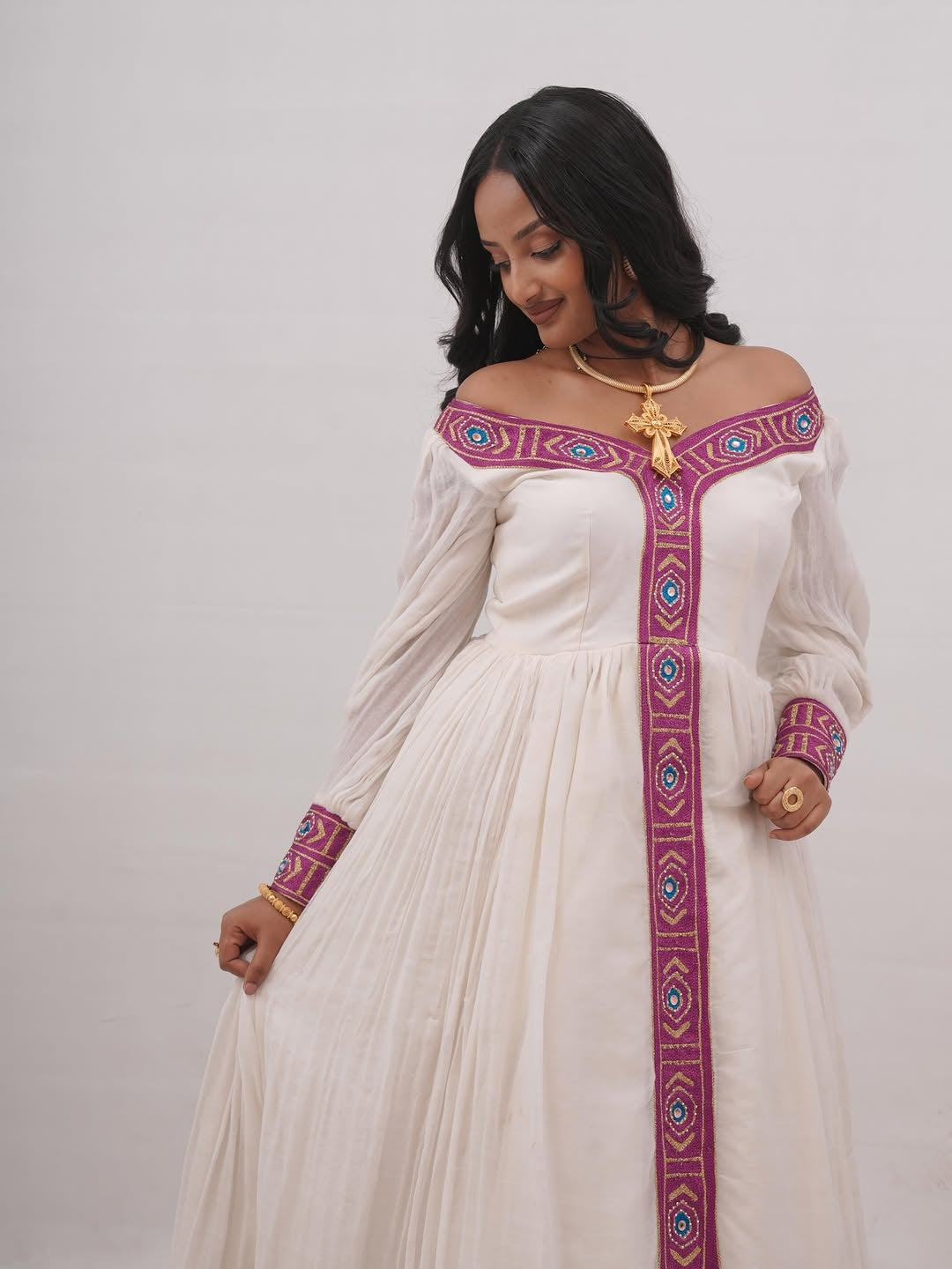 Modern Off-the-Shoulder Habesha Kemis with Traditional Embroidery & Long Sleeves for Weddings & Cultural Occasions