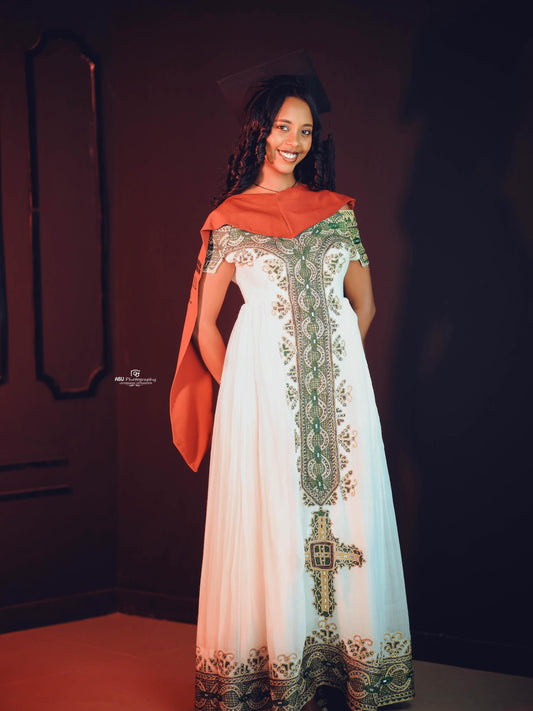 Green Habesha zuria in soft chiffon featuring gold embroidery for graduation celebrations