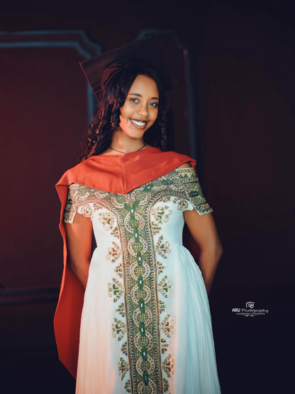 Green Habesha zuria in soft chiffon featuring gold embroidery for graduation celebrations