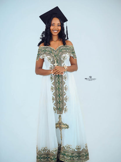 Green Habesha zuria in soft chiffon featuring gold embroidery for graduation celebrations