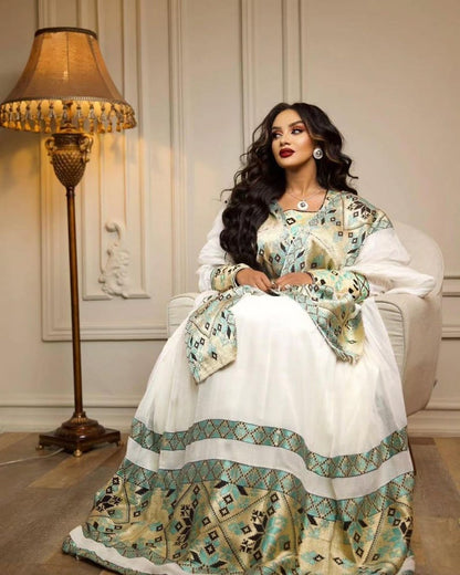 Green Habesha kemis in soft dress featuring gold tibeb embroidery for holiday ceremony