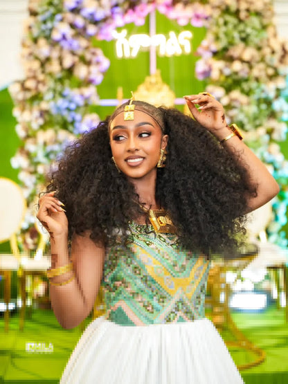 Woman with large Green Habesha Wedding Dress  in a decorated indoor setting