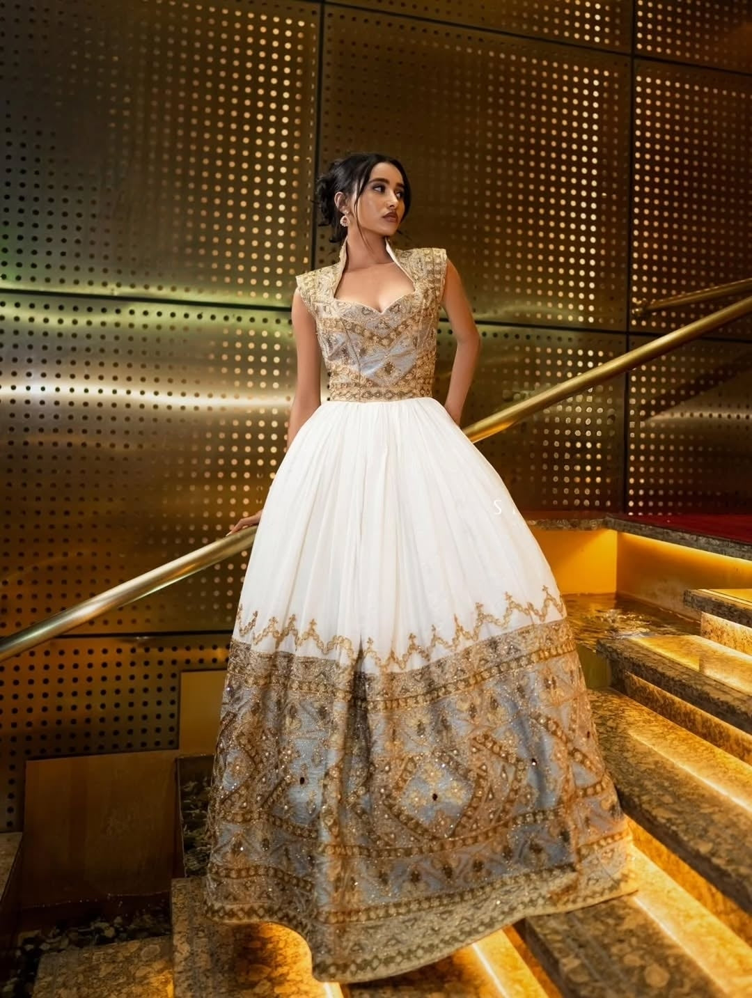 Green Ethiopian Wedding Dress with gold Tilf embroidery. Custom-made bridal Habesha Kemis for weddings, Mels ceremonies, and celebrations.