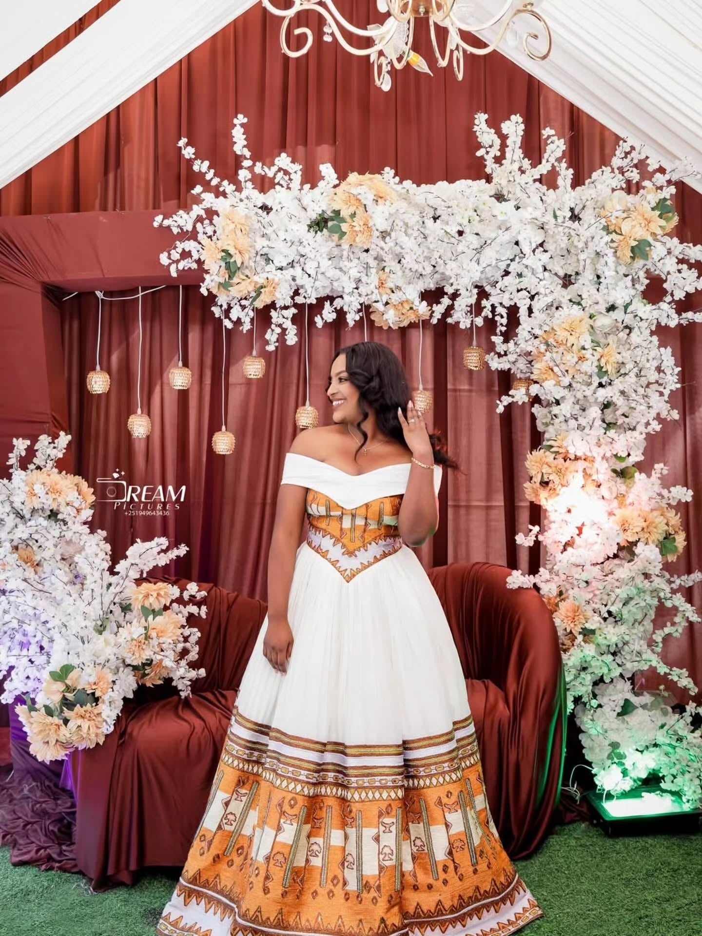 Gold Habesha wedding dress finished with silver tilf embroidery for diaspora weddings and bridal parties