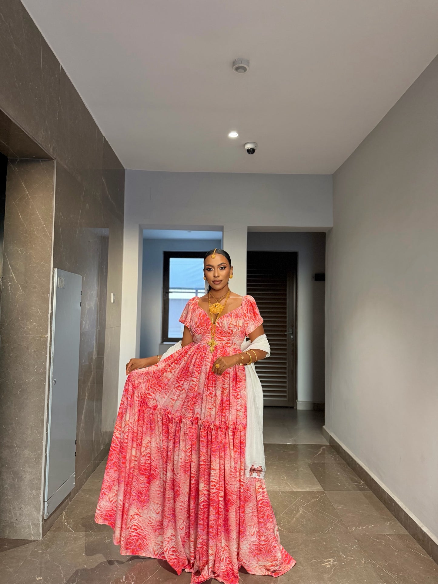Pink chiffon Habesha zuria with silver tilf embroidery for Fasika and engagement ceremonies