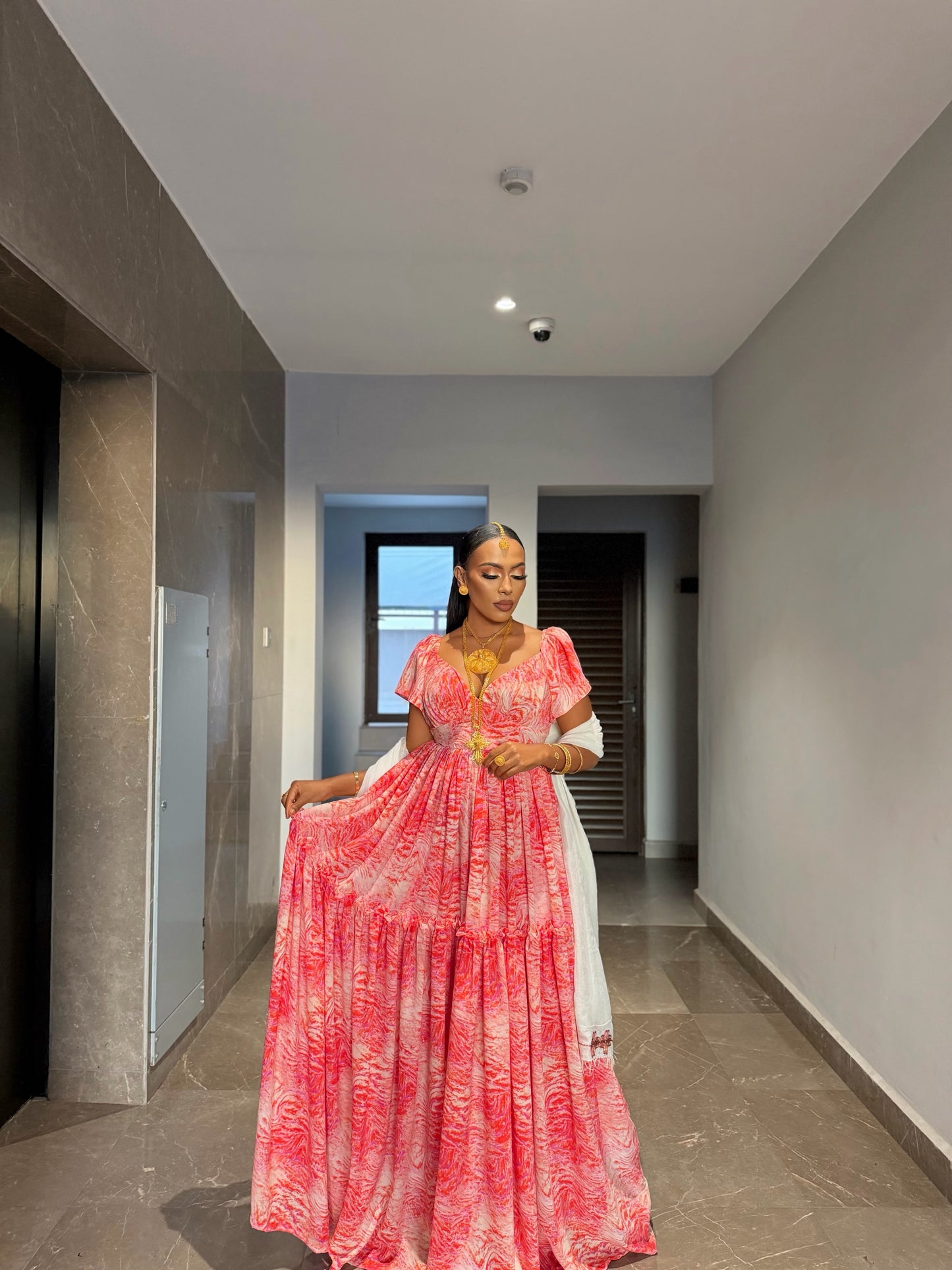 Pink chiffon Habesha zuria with silver tilf embroidery for Fasika and engagement ceremonies