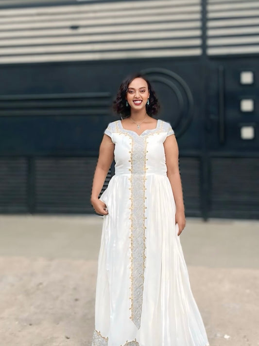 White and Gold Tilet Habesha Dress – Colorful Ethiopian Kemis with Bold Patterns