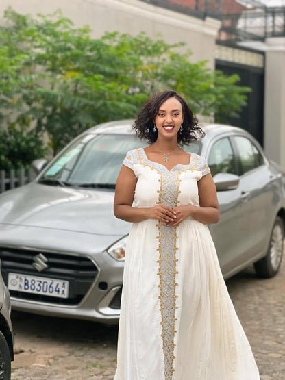 White and Gold Tilet Habesha Dress – Colorful Ethiopian Kemis with Bold Patterns
