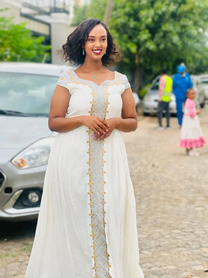 White and Gold Tilet Habesha Dress – Colorful Ethiopian Kemis with Bold Patterns