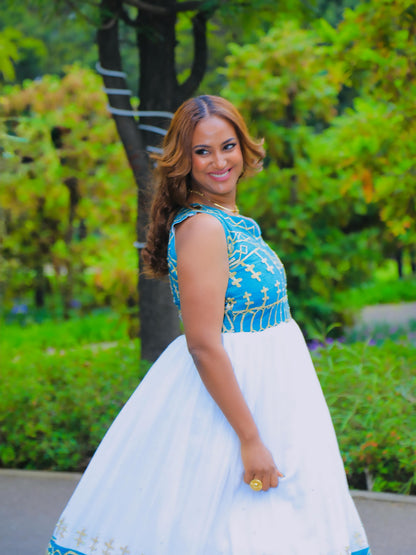 Sky Blue cotton Habesha dress with gold tilf embroidery for wedding celebrations