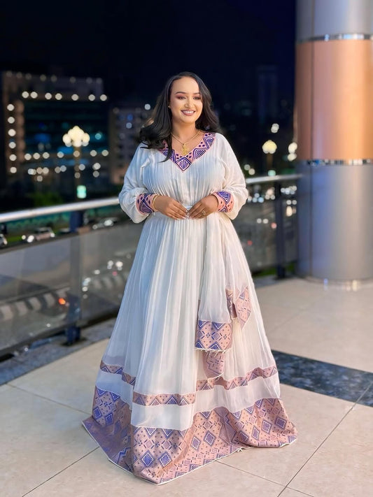 ሮዝ የሀበሻ ቀሚስ | ባህላዊነትን ከዘመናዊ ውበት ጋር የያዘ ልብስ